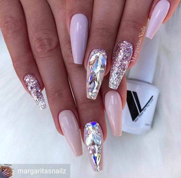So beautiful unicorn nail color with accent glitter nail and one nail with rhinestones