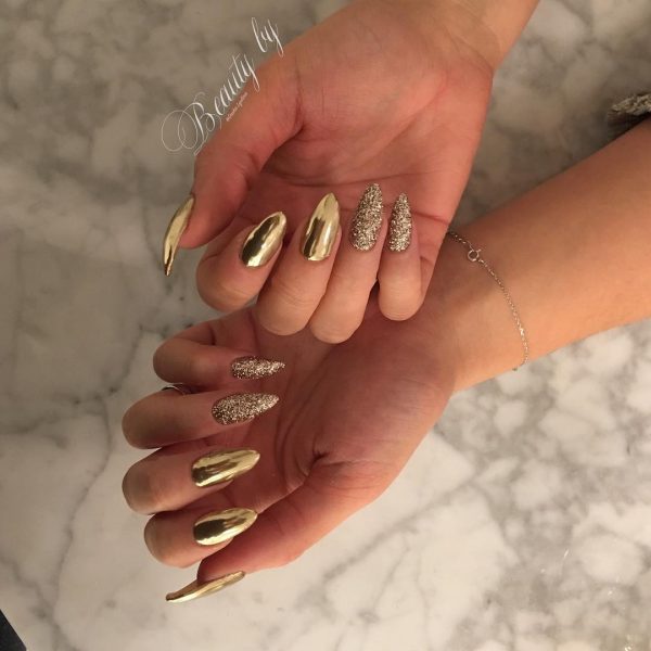 Elegant Gold Chrome Nails Elegant Stiletto Gold Chrome Nails with Two Gold Glitter Accent Nails