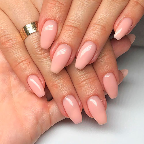 Nude acrylic ballerina shaped nails that considered one of the best nude coffin nails sets