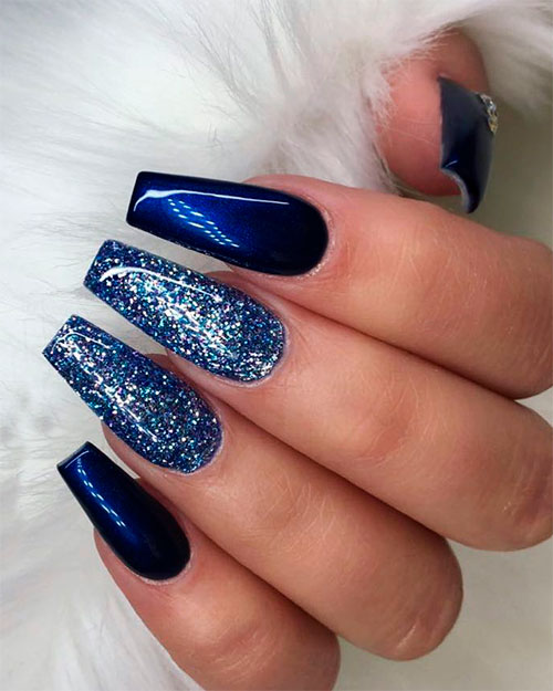 Cute navy blue coffin nails with glitter!