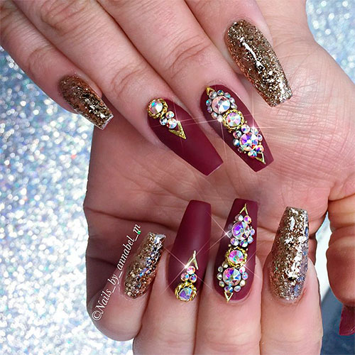 Gorgeous burgundy coffin nails with golden glitter and rhinestones!