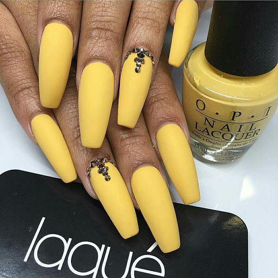 Matte yellow acrylic nails coffin shape long with gold rhinestones on accent nail