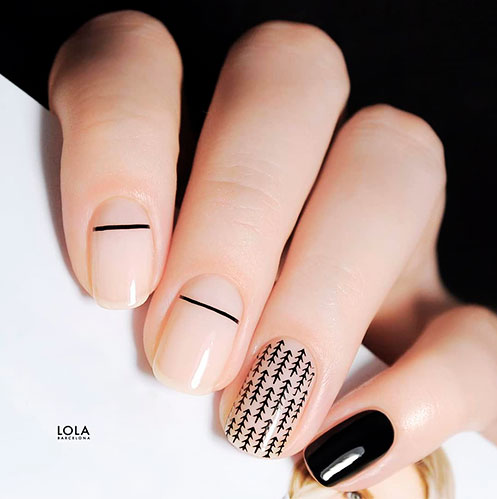Amazing short nude nail design with accent black nail, and a nail with black arrows! Amazing short nude nail design with accent black nail, and a nail with black arrows!