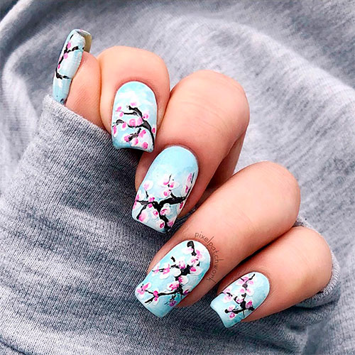 Beautiful light blue matte squoval floral nails for spring 2019