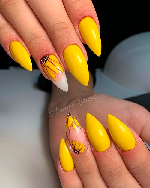 Cute yellow nails with an accent sunflower nail that suits spring season 2019