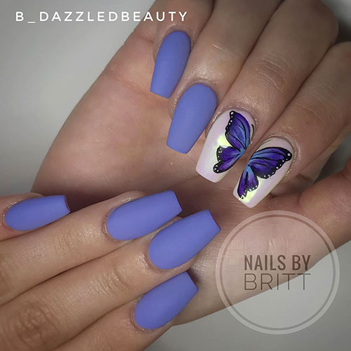 Spring butterfly wing nail art on blue matte coffin nails with a hand-painted purple butterfly on white chrome nails.