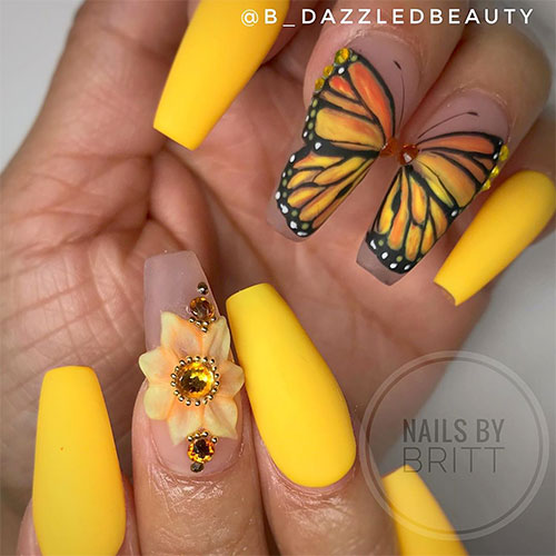 Spring butterfly wing nail art on yellow matte coffin nails with hand painted a butterfly on middle and ring fingernail for spring 2019