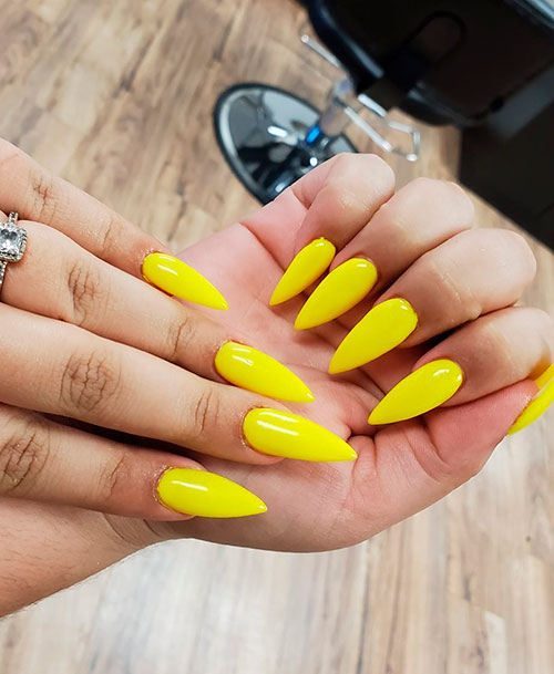 Cute shine yellow stiletto nails for summer 2019 Cute shine yellow stiletto nails for summer 2019
