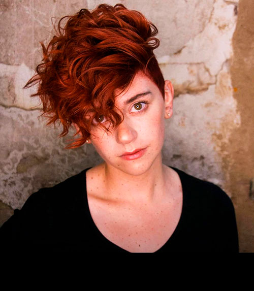Beautiful red hair with undercut curly pixie hairstyle Beautiful red hair with undercut curly pixie hairstyle