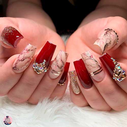 Beautiful red nails with gold glitter and diamonds with amazing coffin shaped marble nails, red and gold nails