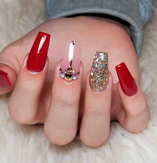 Gorgeous red nails with gold glitter on an accent nail and nude middle fingernail adorned with rhinestones!, red and gold nails