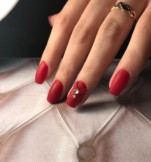 Matte red nail with awesome rhinestones