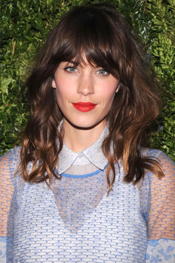 Alexa Chung - Shag haircut with heavy bangs.