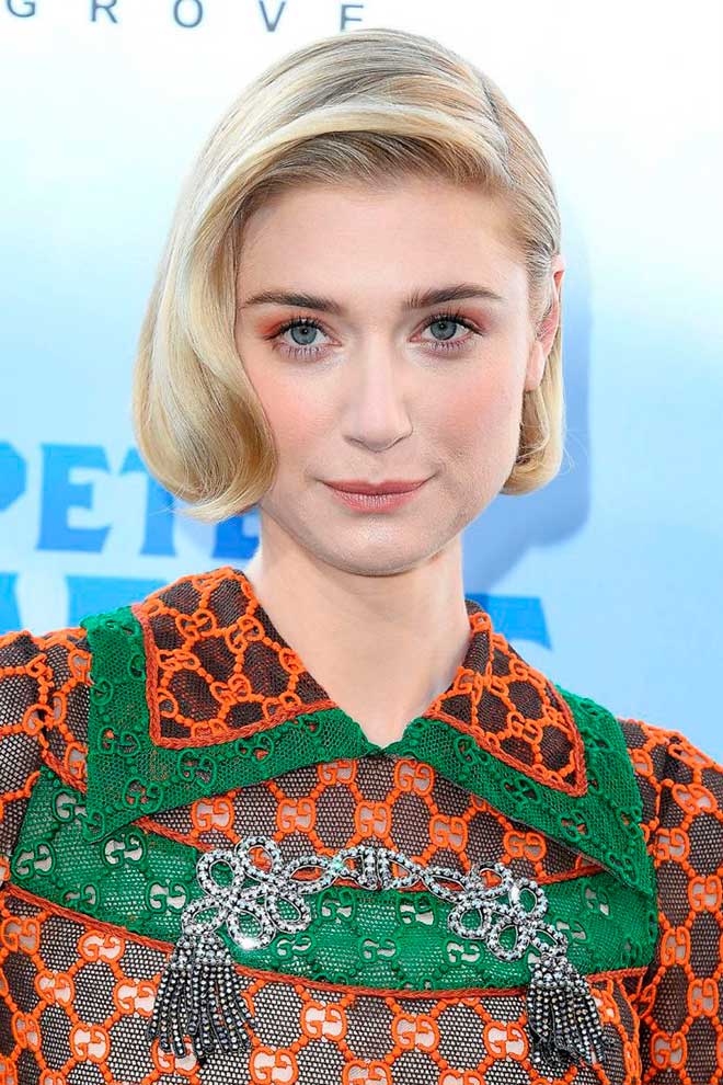 Elizabeth Debicki with a sleek, deep part short bob haircut with lightly smooth curled ends