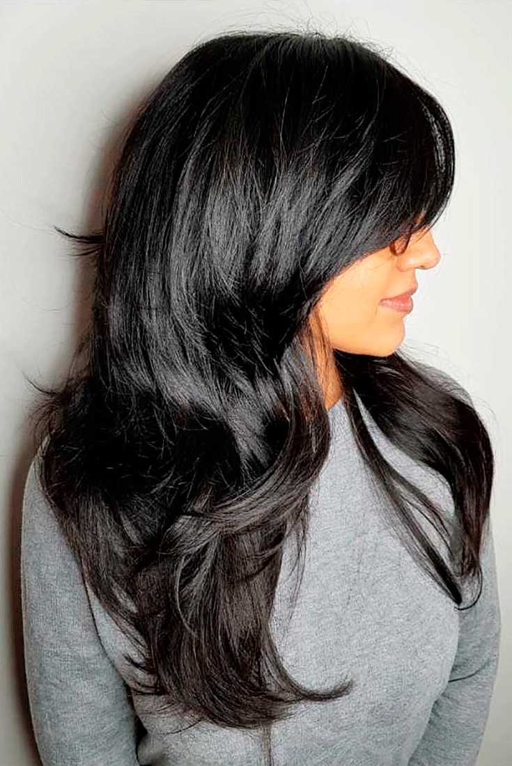 Modern shag haircut with long curtain fringe. Modern shag haircut with long curtain fringe.