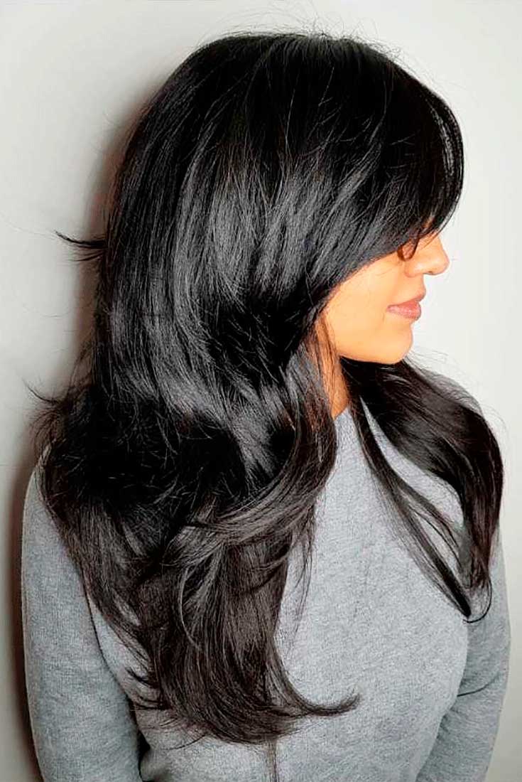 Modern shag haircut with long curtain fringe.