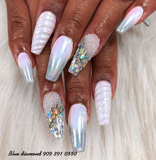 Amazing unicorn, sugar, and diamond nails with an accent unicorn horn nail!