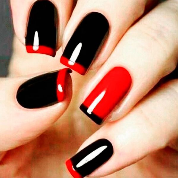 Cute black squoval French tip nails with red tips and an accent red nail with black tip