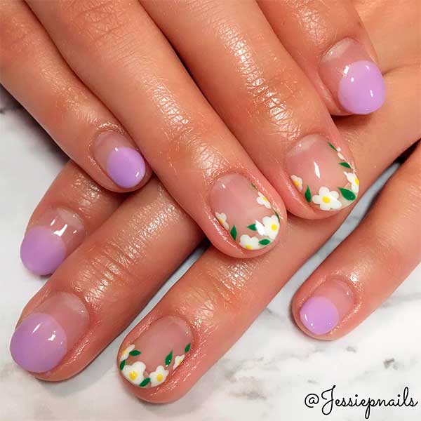 Cute light purple round French tip nails with floral nails tips design! Cute light purple round French tip nails with floral nails tips design!