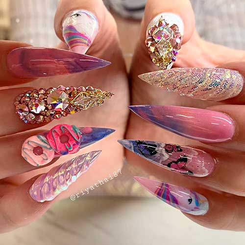 Cute stiletto unicorn nail art with rhinestones and glitter! Cute stiletto unicorn nail art with rhinestones and glitter!