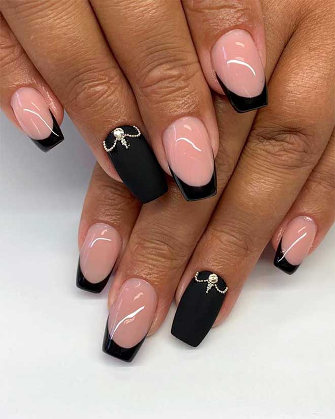 Gorgeous black coffin shaped French tip nails with an accent matte black coffin nail adorned with rhinestones!