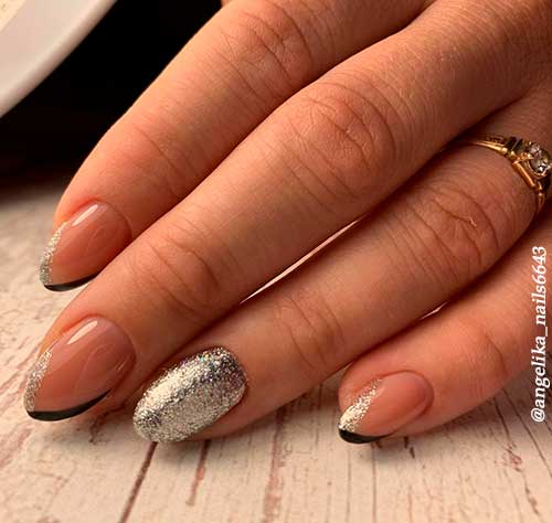 Gorgeous two color french tip nails design that combine black and silver nail polishes