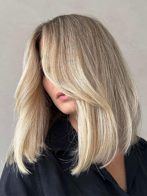 Shoulder length modern bob with blunt ends, curtain bangs, and internal layering Shoulder length modern bob with blunt ends, curtain bangs, and internal layering