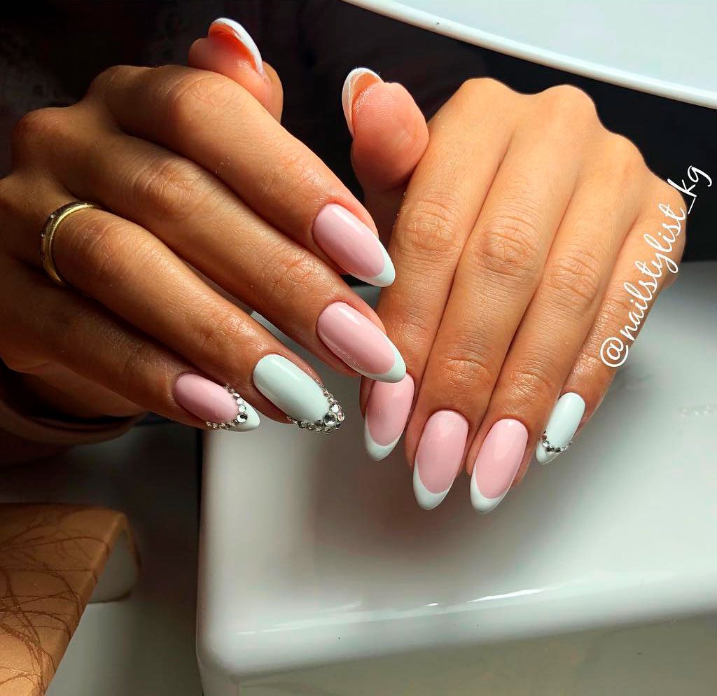 Stunning Baby Pink Almond French manicure with white french tips and white accent nail with rhinestones