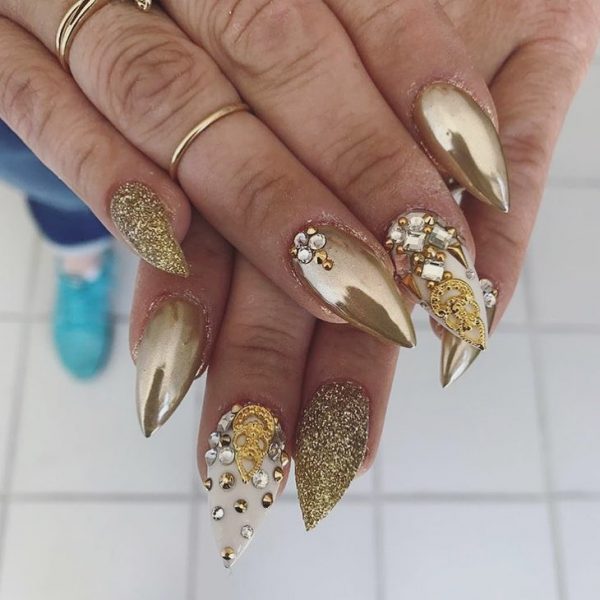 Amazing Stiletto Gold Chrome Nails with Glitter and Rhinestones