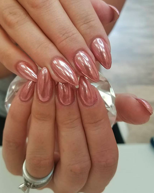 Beautiful short rose gold short stiletto nails