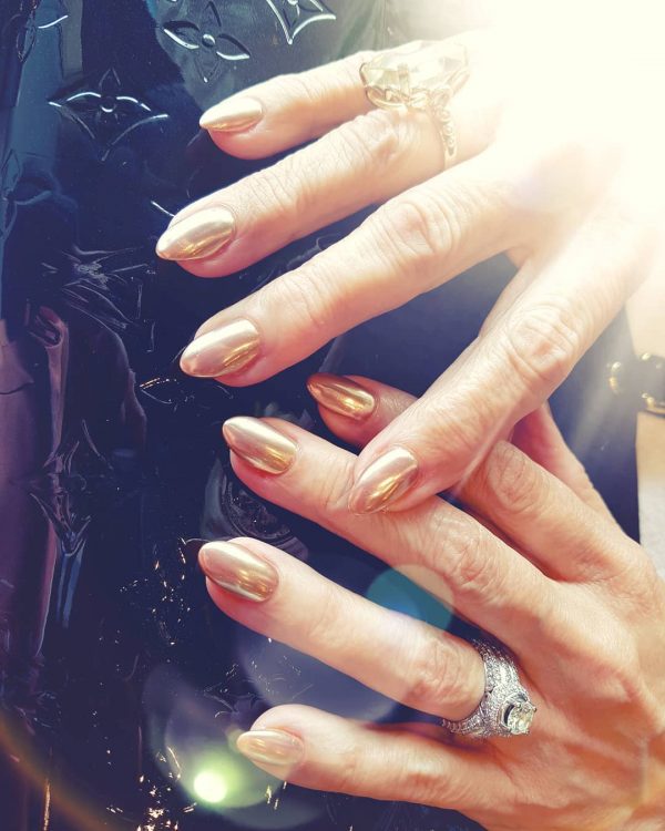 Short almond shaped gold chrome nails