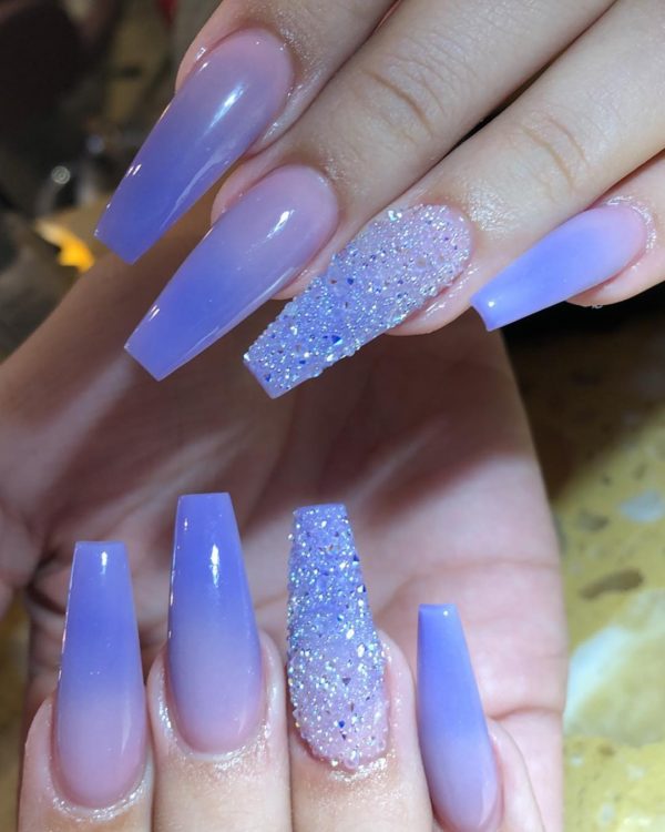 Beautiful ombre purple coffin nails with accent purple glitter nail!