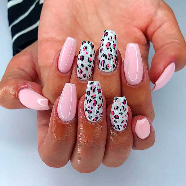 Glossy baby pink coffin nails with two leopard print nails!