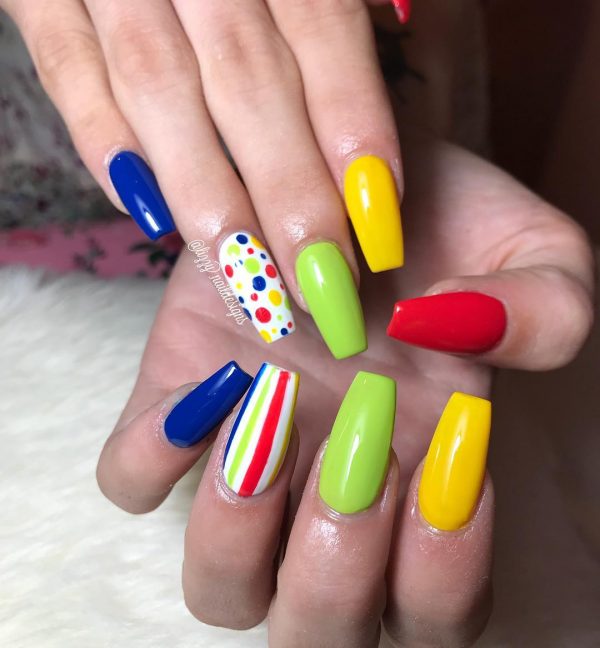 Stylish colorful coffin nails with accent strip nail and another accent dot nail in the other hand!