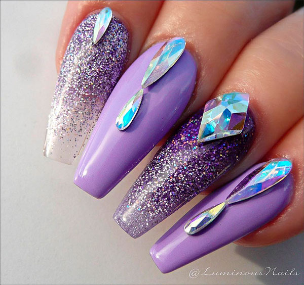 Adorable light purple coffin nails design with crystals and glitter