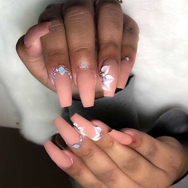 Matte nude coffin nails with rhinestones and 3d floral accent nail