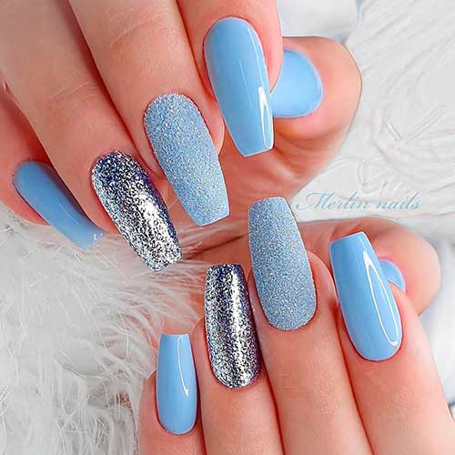 Cute baby blue coffin nails with two accent glitter nails design! Cute baby blue coffin nails with two accent glitter nails design!