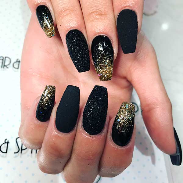 Cute black and gold glitter nails!