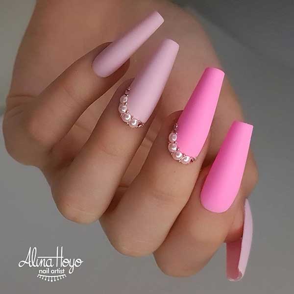 Cute matte baby pink coffin nails with two accent matte hot pink coffin nails design which adorned with rhinestones!