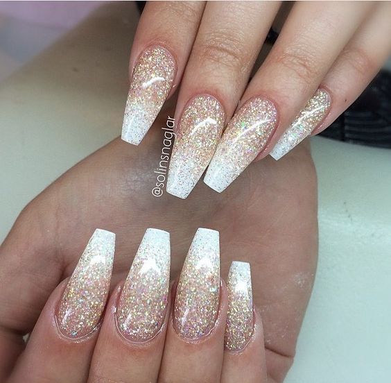 Cute pink and white ombre nails with gold glitter