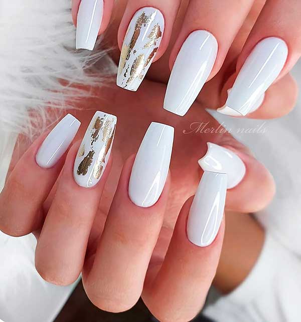 Cute white coffin nails with gold foil accent nail design!