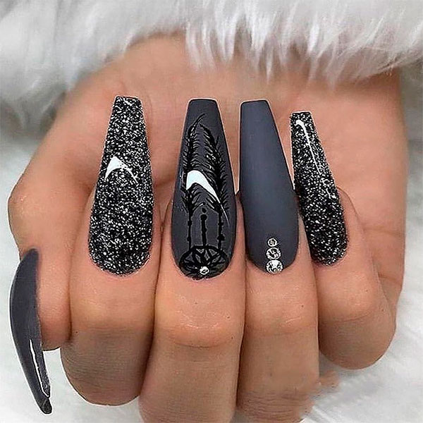 Credit: Gorgeous black coffin nails design, including matte and glitter nails
