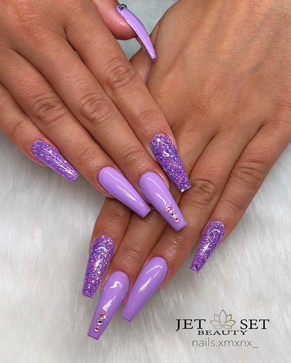 Gorgeous light purple coffin nails set with glitter and rhinestones!