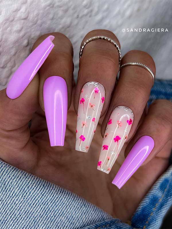Long Light purple coffin nails with pink flowers on milky white accent nails Long Light purple coffin nails with pink flowers on milky white accent nails