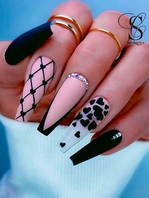 Long coffin matte black valentine’s nails feature black glitter, hearty fishnet, French tip accent, and rhinestones