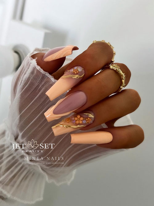 Long coffin peach nails mixing French tip nails and French ombre nails that adorned with flowers and gold chrome decorations Long coffin peach nails mixing French tip nails and French ombre nails that adorned with flowers and gold chrome decorations