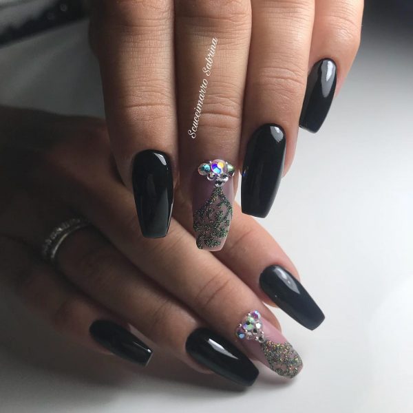Stunning black ballerina nails with diamonds in accent nail!