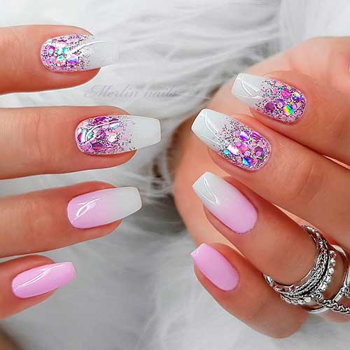 Stunning white coffin shaped nails with glitter, accent coffin pink and white ombre nail, and accent pink coffin nail design!