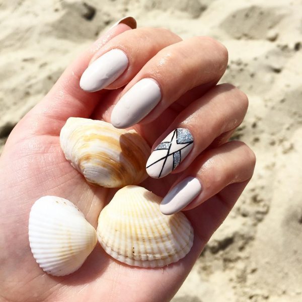 Amazing white summer nails with accent glittery fishy nail Amazing white summer nails with accent glittery fishy nail