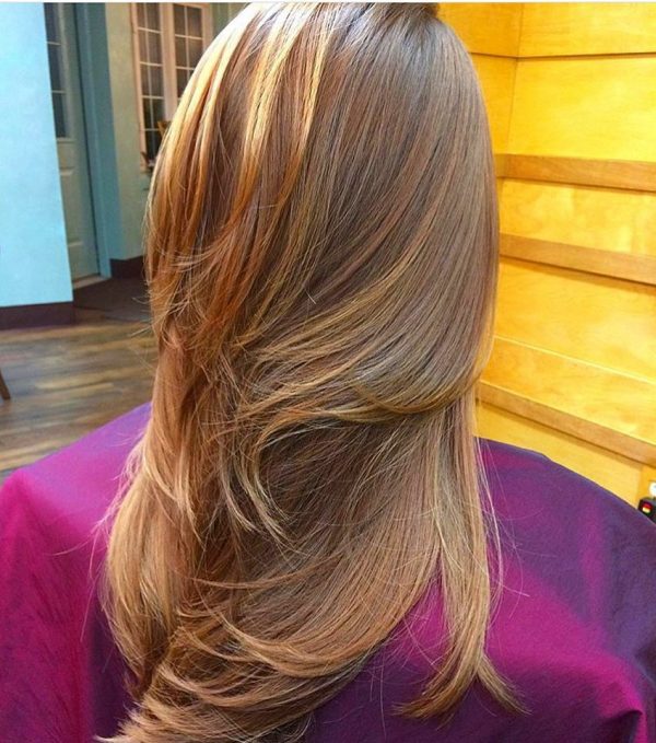 Stunning strawberry blonde balayage uses pureology hydrate shampoo and conditioner!